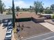 Single-story home featuring desert landscaping, a two-car garage, and a spacious driveway at 848 S Revolta Cir, Mesa, AZ 85208