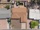 Stunning aerial view of the home with backyard oasis, covered patio, and a cozy fire pit, perfect for outdoor living at 848 S Revolta Cir, Mesa, AZ 85208