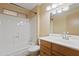Bright bathroom featuring a shower-tub combo, modern vanity, and updated fixtures at 848 S Revolta Cir, Mesa, AZ 85208