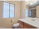 Bathroom featuring a vanity, toilet, and shower with natural light from the window at 848 S Revolta Cir, Mesa, AZ 85208