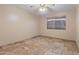 Bedroom featuring a ceiling fan, neutral paint, and travertine tile flooring at 848 S Revolta Cir, Mesa, AZ 85208