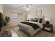 Serene bedroom showcasing a comfortable bed, soft lighting, and warm accents at 848 S Revolta Cir, Mesa, AZ 85208