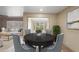 Formal dining room with views of the yard with an opening into the living room at 848 S Revolta Cir, Mesa, AZ 85208