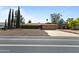 Charming single-story home featuring tidy shrubbery, a two-car garage, and desert-style landscaping at 848 S Revolta Cir, Mesa, AZ 85208