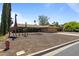 Single-story home with desert landscaping, two-car garage, and decorative giraffe statues at 848 S Revolta Cir, Mesa, AZ 85208