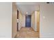 Welcoming hallway with tile floors leading to the front door and other rooms at 848 S Revolta Cir, Mesa, AZ 85208