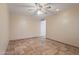 Bright room with tile floors and ceiling fan at 848 S Revolta Cir, Mesa, AZ 85208