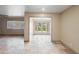 Living room with tile floors and large opening to what appears to be the backyard at 848 S Revolta Cir, Mesa, AZ 85208