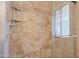 Modern shower featuring stylish tile work, glass door, and convenient shelving for toiletries at 848 S Revolta Cir, Mesa, AZ 85208
