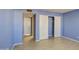 Light blue bedroom with wood-look floors and mirrored closet doors at 10437 E Chestnut Dr, Sun Lakes, AZ 85248