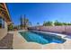 Relaxing kidney-shaped pool with desert landscape at 10437 E Chestnut Dr, Sun Lakes, AZ 85248