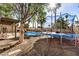 Backyard with trampoline, pool, and covered patio at 6511 E Presidio Rd, Scottsdale, AZ 85254