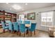 Dining area featuring a large table and blue chairs at 6511 E Presidio Rd, Scottsdale, AZ 85254