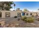 Front view of a single-story house with drought-tolerant landscaping at 6511 E Presidio Rd, Scottsdale, AZ 85254