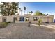 Single-story home with a desert landscaping and basketball court at 6511 E Presidio Rd, Scottsdale, AZ 85254
