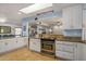 Bright kitchen featuring granite countertops and white cabinetry at 6511 E Presidio Rd, Scottsdale, AZ 85254