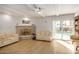 Bright living room with a fireplace, sliding doors, and light flooring at 6511 E Presidio Rd, Scottsdale, AZ 85254