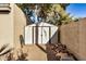 White storage shed in backyard with gravel ground at 6511 E Presidio Rd, Scottsdale, AZ 85254