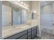 Modern bathroom with double vanity and a bathtub at 16367 W Morning Glory St, Goodyear, AZ 85338