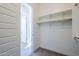 Spacious closet with built-in shelves and rods at 16367 W Morning Glory St, Goodyear, AZ 85338