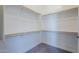 Large walk-in closet with ample shelving and hanging space at 16367 W Morning Glory St, Goodyear, AZ 85338