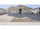 New construction home with landscaped front yard at 16367 W Morning Glory St, Goodyear, AZ 85338