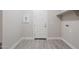 Laundry room with door to outside and built-in shelving at 16367 W Morning Glory St, Goodyear, AZ 85338