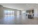 Bright living room with tile floors and sliding glass doors at 16367 W Morning Glory St, Goodyear, AZ 85338