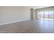 Spacious living area with tile floors and access to backyard at 16367 W Morning Glory St, Goodyear, AZ 85338