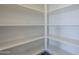 Large walk-in pantry with ample shelving at 16367 W Morning Glory St, Goodyear, AZ 85338