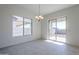 Bright dining area with sliding glass doors leading to the backyard at 16417 W Desert Mirage Dr, Surprise, AZ 85388