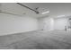 Attached garage with overhead storage and epoxy flooring at 16417 W Desert Mirage Dr, Surprise, AZ 85388