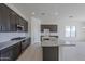 Modern kitchen with granite countertops and stainless steel appliances at 16417 W Desert Mirage Dr, Surprise, AZ 85388