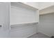 Spacious walk-in closet with double hanging rods and shelving at 16417 W Desert Mirage Dr, Surprise, AZ 85388