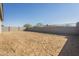 Large backyard with block wall and dirt at 16425 W Desert Mirage Dr, Surprise, AZ 85388