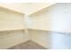 Spacious walk-in closet with double hanging rods at 16425 W Desert Mirage Dr, Surprise, AZ 85388