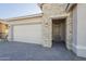 House exterior showcasing a stone facade and garage at 16425 W Desert Mirage Dr, Surprise, AZ 85388