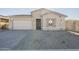 One-story home with stone accents and a two-car garage at 16425 W Desert Mirage Dr, Surprise, AZ 85388