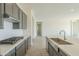 Modern kitchen with gray cabinets, white subway tile, and gas cooktop at 16425 W Desert Mirage Dr, Surprise, AZ 85388