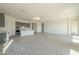 Open living room with gray kitchen cabinets and island visible at 16425 W Desert Mirage Dr, Surprise, AZ 85388