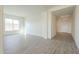 Spacious living room with tile flooring and large window at 16425 W Desert Mirage Dr, Surprise, AZ 85388