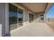 Covered patio with sliding glass doors at 16425 W Desert Mirage Dr, Surprise, AZ 85388