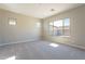 Spacious bedroom with carpeted floor and large window at 266 S 165Th Ave, Goodyear, AZ 85338