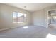 Bright bedroom with carpeted floor and large window at 266 S 165Th Ave, Goodyear, AZ 85338