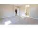 Bright bedroom with carpet flooring and access to bathroom and kitchen at 266 S 165Th Ave, Goodyear, AZ 85338