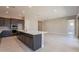 Spacious kitchen with an island and stainless steel appliances at 266 S 165Th Ave, Goodyear, AZ 85338