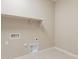 Laundry room with shelving and space for washer/dryer at 266 S 165Th Ave, Goodyear, AZ 85338