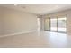 Bright and airy living room with tile floors and sliding glass doors at 266 S 165Th Ave, Goodyear, AZ 85338