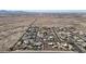 An aerial view of the neighborhood, with desert landscaping and mountain views at 19517 W Huron Ln, Buckeye, AZ 85326