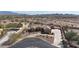 Aerial view of the home showcasing desert landscaping and mountain views at 19517 W Huron Ln, Buckeye, AZ 85326